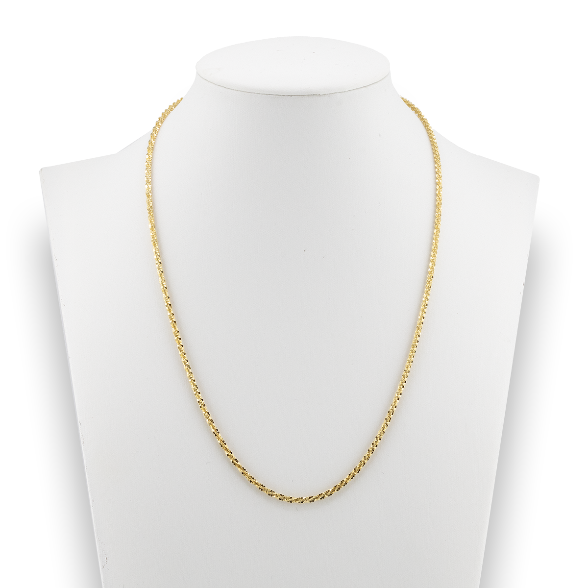 Gold chain necklace on a mannequin bust against a white background