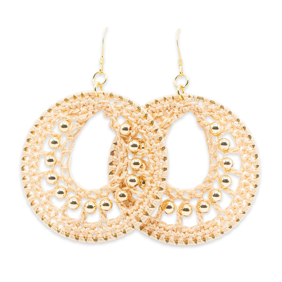 Gold hoop earrings with intricate detailing on a white background
