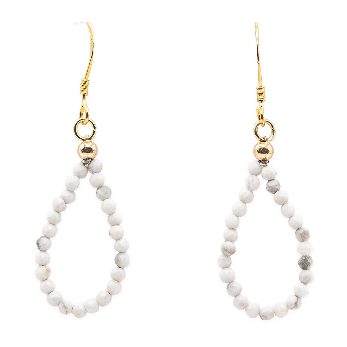 Pair of white beaded earrings with gold hooks on a white background