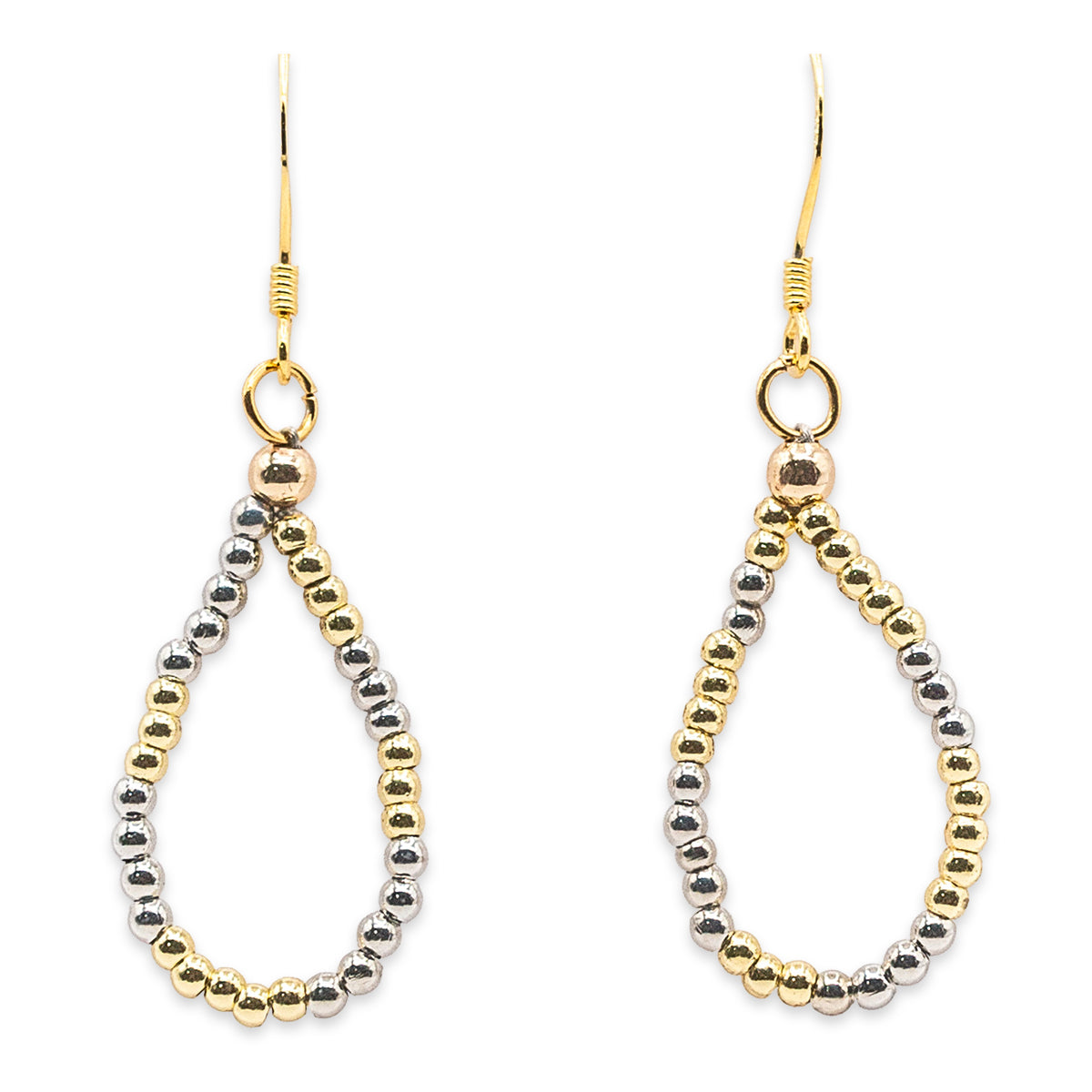 Pair of gold and silver teardrop-shaped earrings on a white background