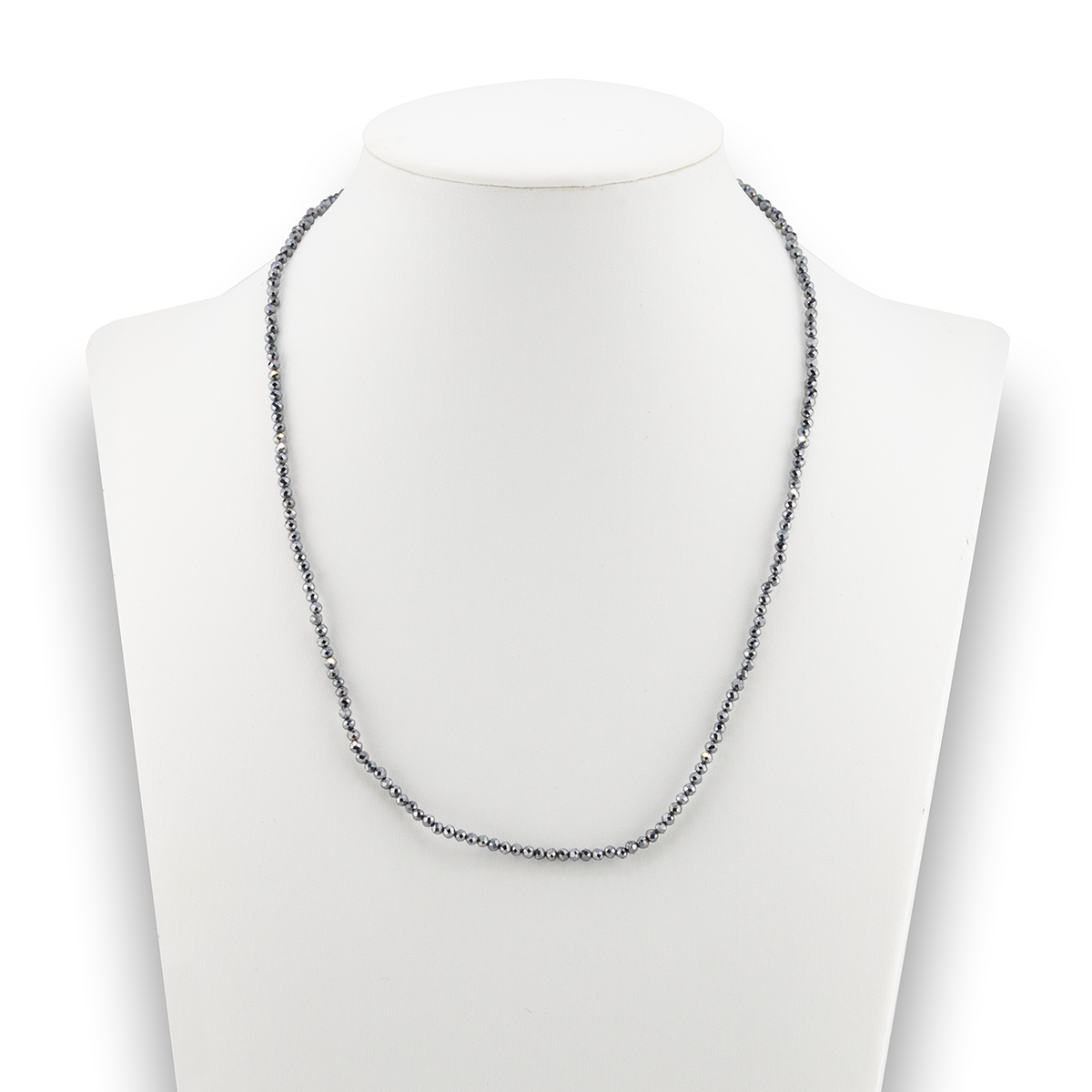 Necklace on a mannequin with a white background