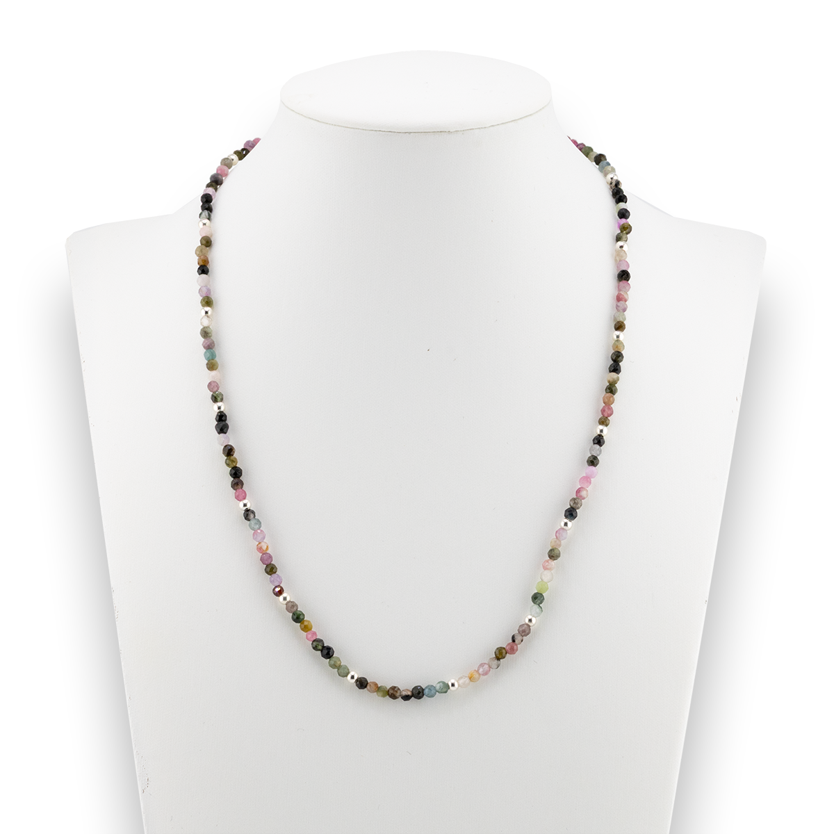 Necklace with multicolored beads on a mannequin bust against a white background