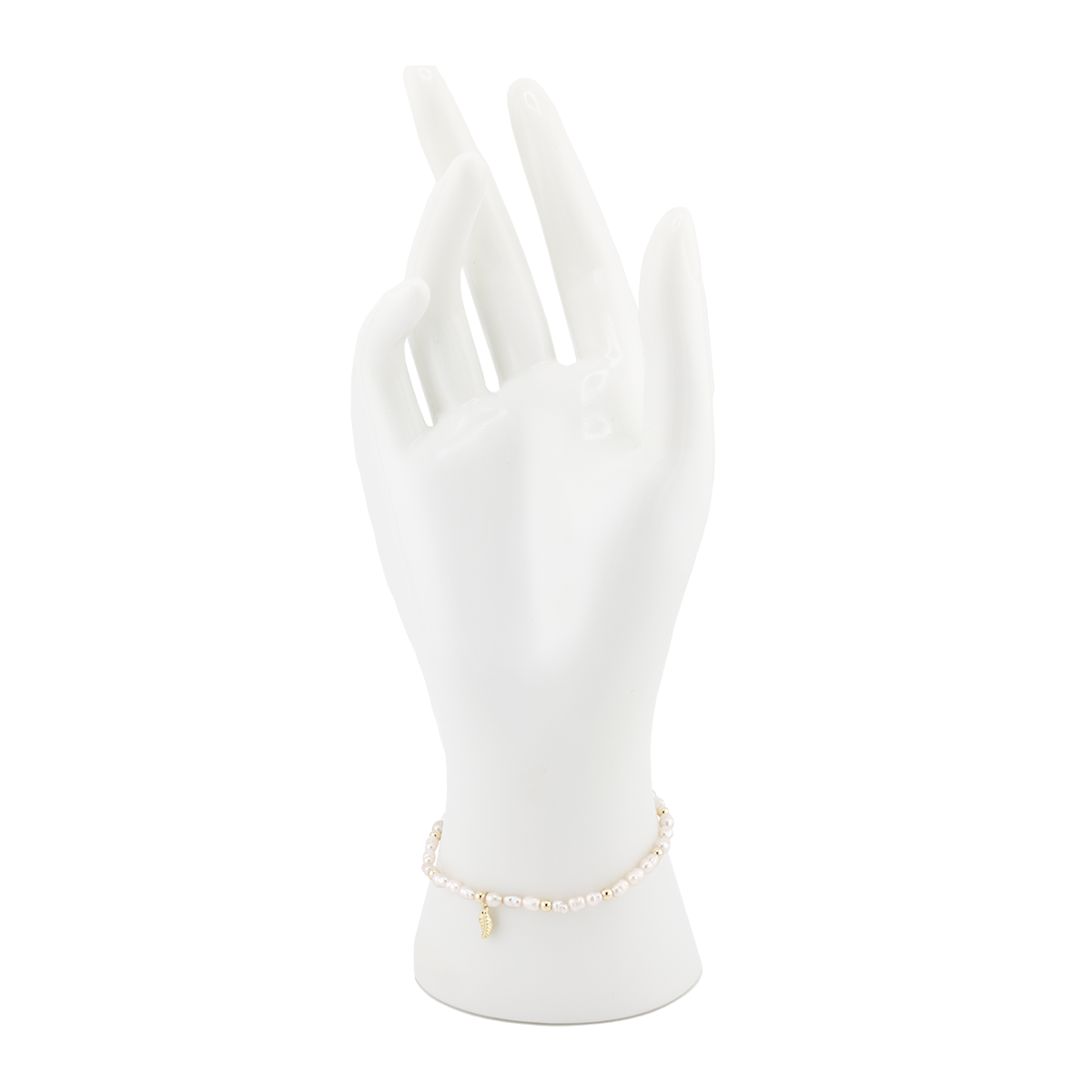 Gold bracelet on a white mannequin hand with a white background