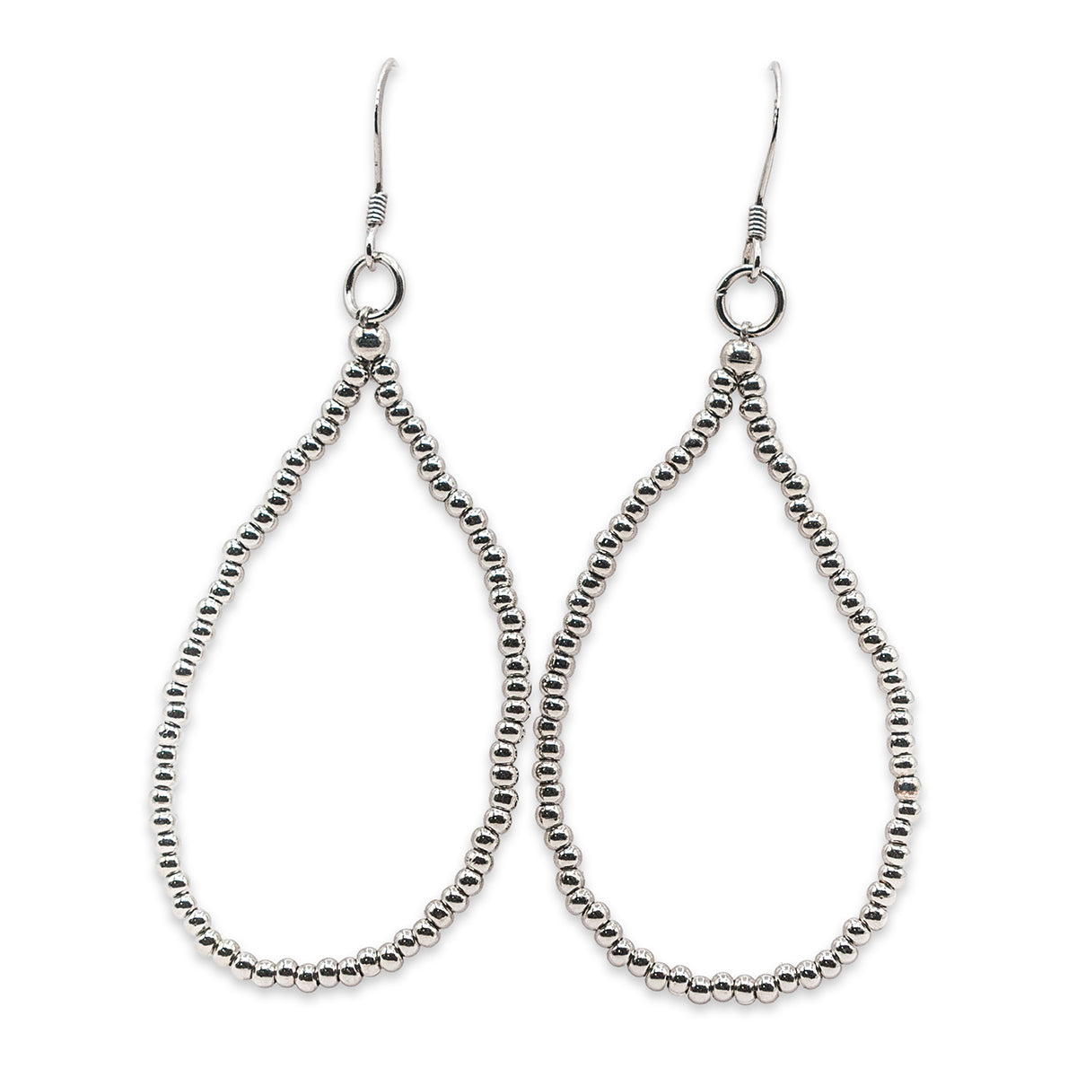 Pair of silver beaded earrings on a white background