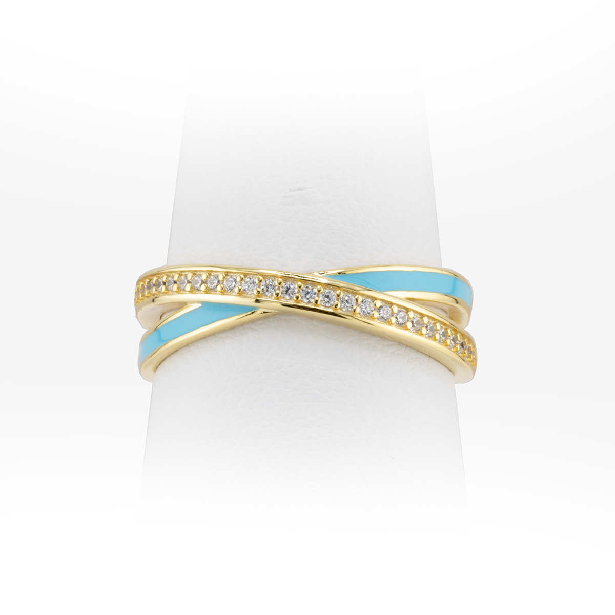 Gold and turquoise ring on a white background