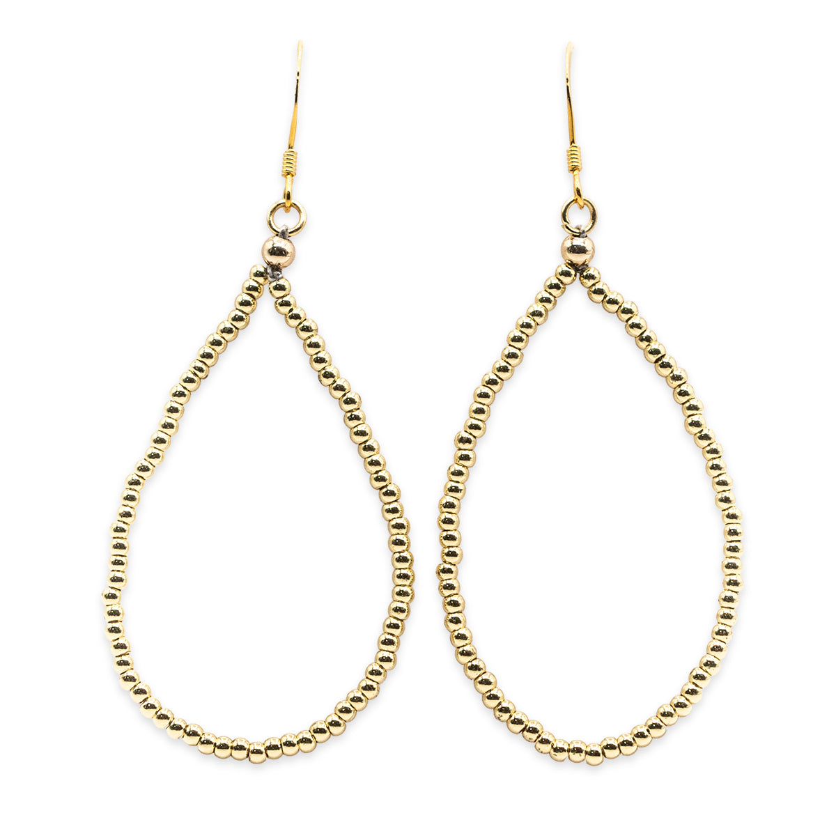 Gold teardrop-shaped earrings on a white background