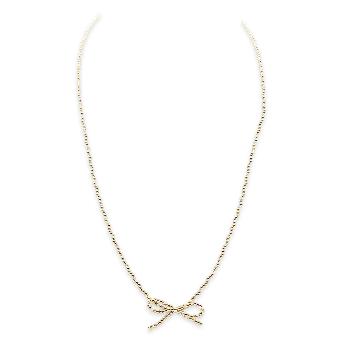 Gold bow-shaped pendant necklace on a white background